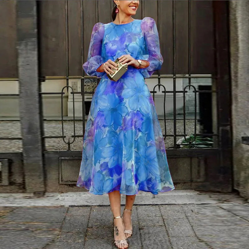 Blue and pink floral print women's dress, elegant fit, ideal for garden parties and weddings, capturing classic femininity.