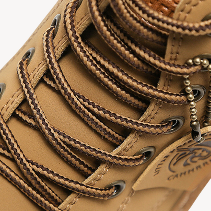 "Brown men's durable leather boots with cushioned insole, rugged sole, lace-up closure, and sleek design; ideal for outdoor u