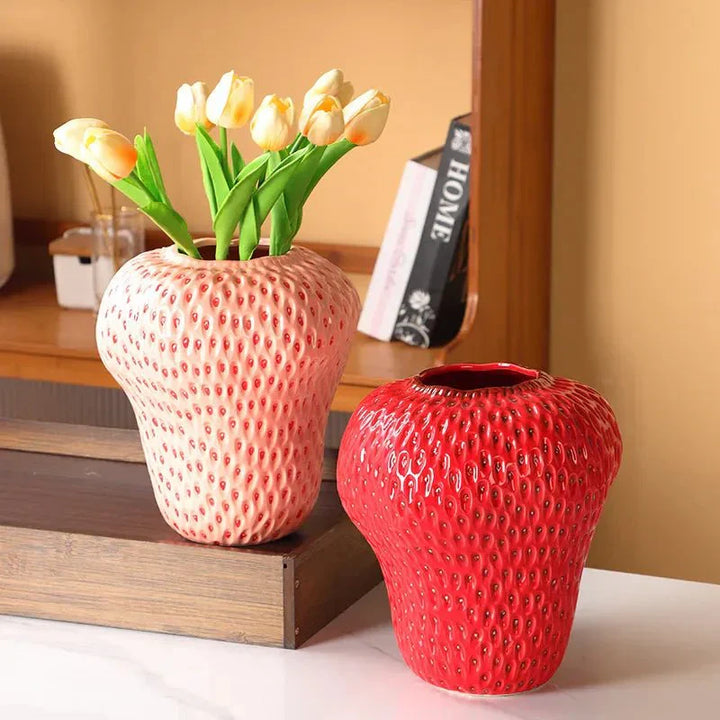 Cartoon strawberry ceramic vase with vibrant colors for kids' room decor, whimsical design ideal for flower arrangement.