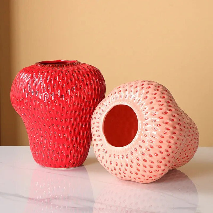 Cartoon strawberry ceramic vase with vibrant colors for kids' room decor, whimsical design ideal for flower arrangement.