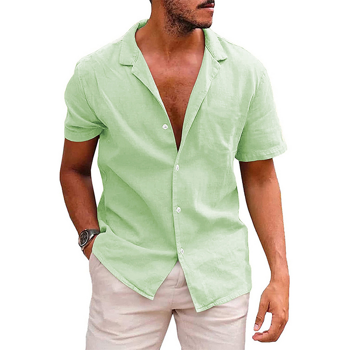 "Casual men's short-sleeve button-down shirt with a relaxed fit and open collar in light blue, perfect for summer comfort."