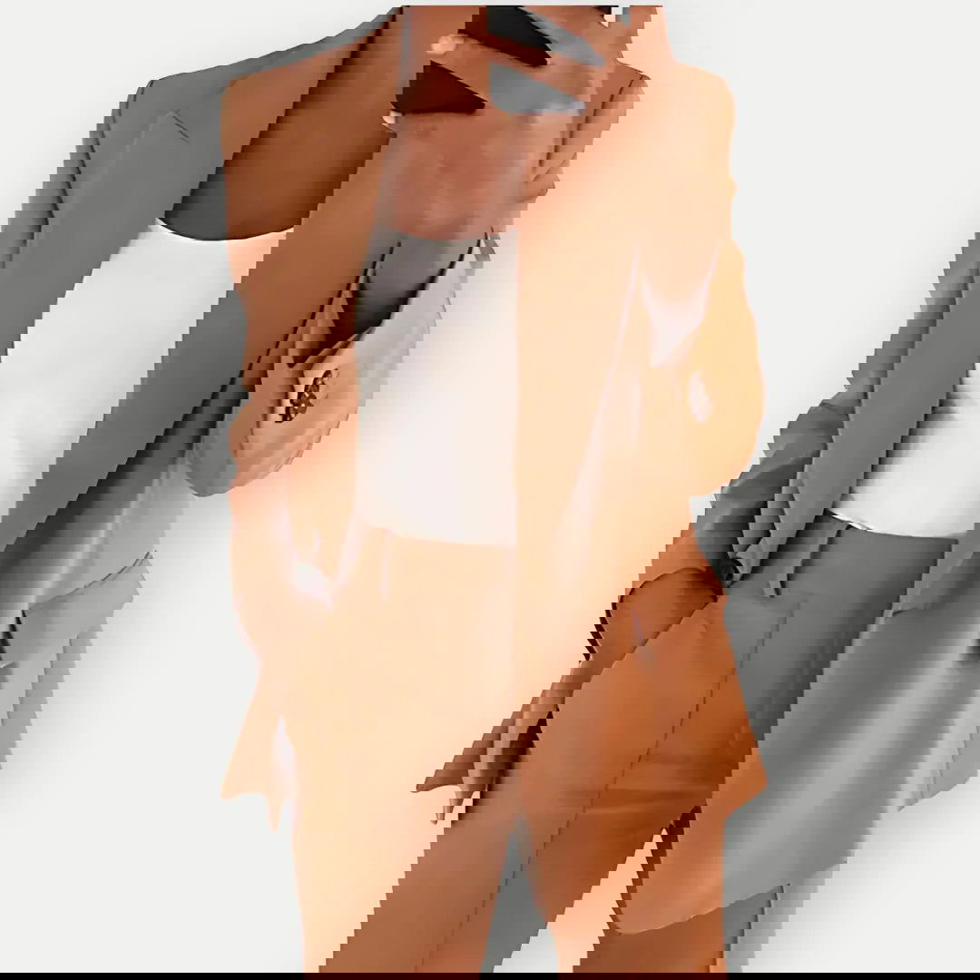 Chic women's tailored blazer and trouser set, elegant business attire with a modern fit, ideal for office or formal events.