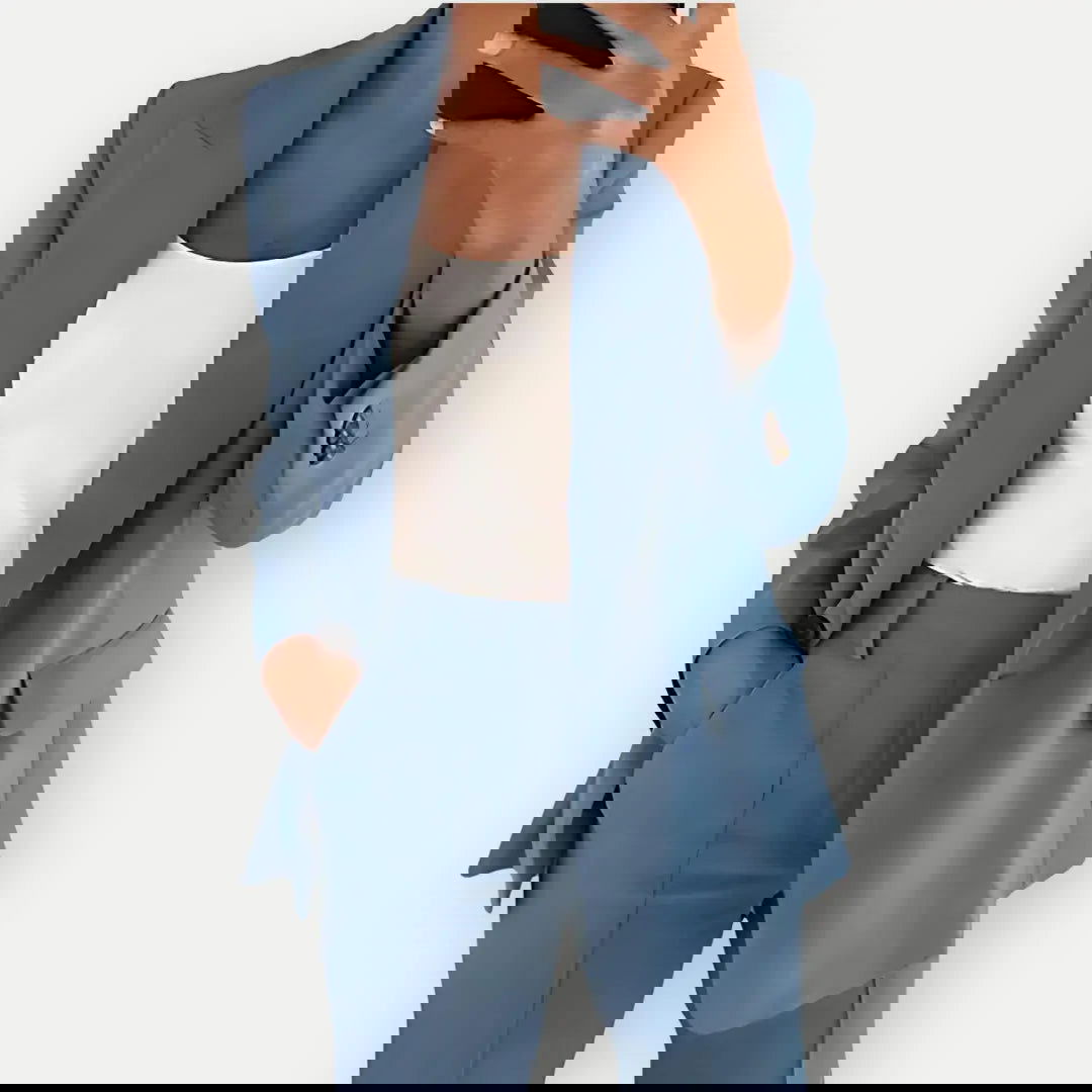 Chic women's tailored blazer and trouser set, elegant business attire with a modern fit, ideal for office or formal events.