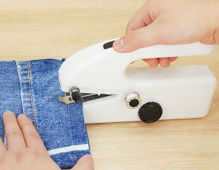 "Compact handheld sewing machine for quick repairs, portable stitching on all fabrics, includes complete sewing kit."