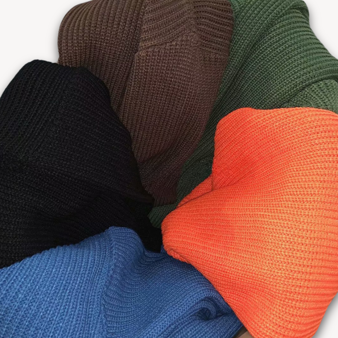 Dark green men's oversized knit sweater, soft acrylic, ribbed texture, cozy winter wear, casual elegance, warm menswear.