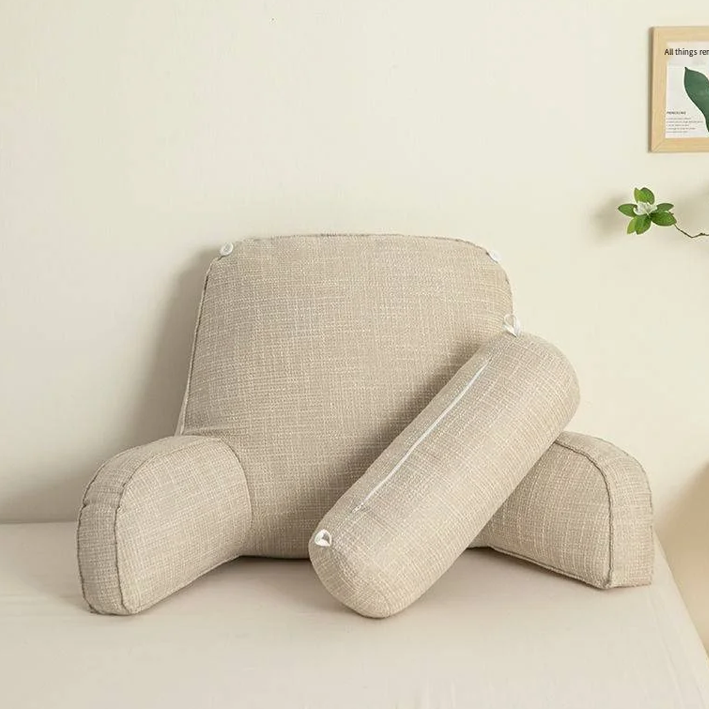 "Deluxe backrest pillow with arms and headrest in cream, featuring a soft-touch finish and side pocket for added convenience.