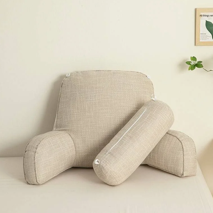"Deluxe backrest pillow with arms and headrest in cream, featuring a soft-touch finish and side pocket for added convenience.