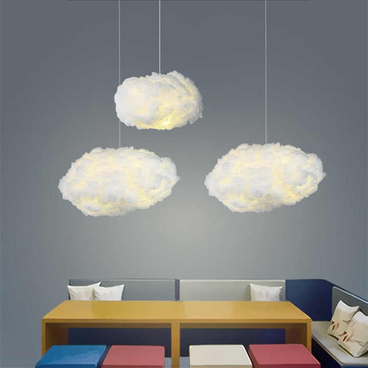 "Dreamy cloud chandelier with soft, fluffy cotton design emits warm, inviting glow for cozy home lighting ambiance."