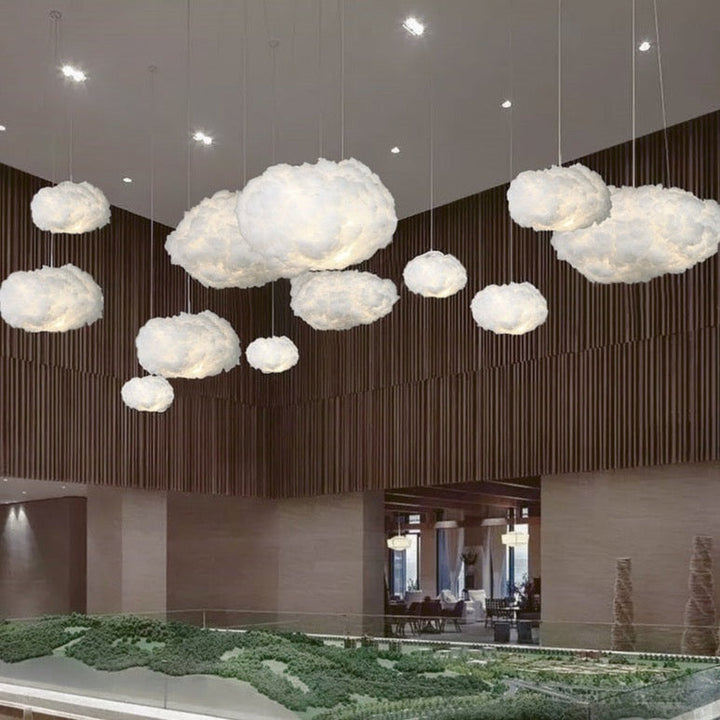 "Dreamy cloud chandelier with soft, fluffy cotton design emits warm, inviting glow for cozy home lighting ambiance."