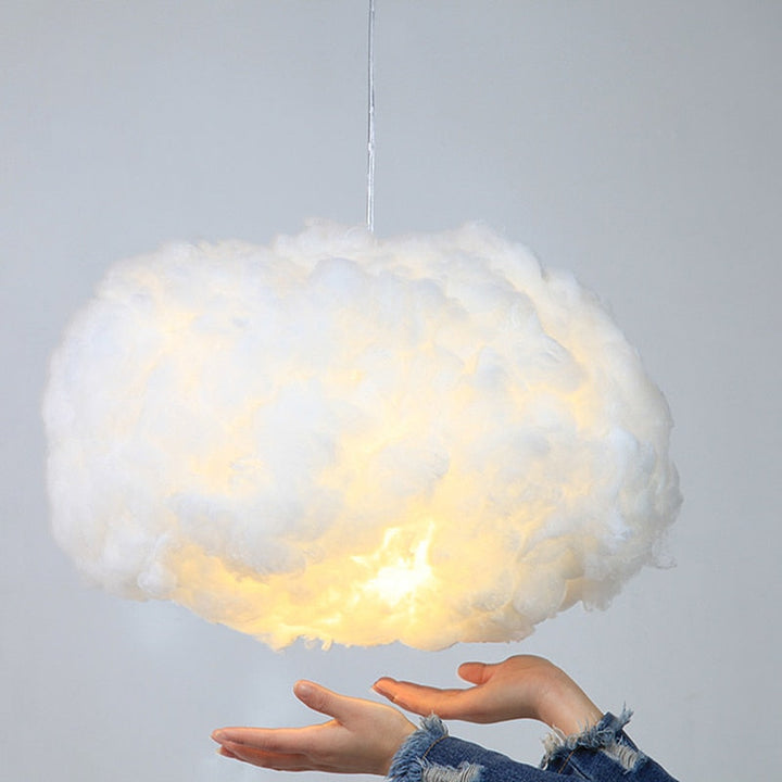 "Dreamy cloud chandelier with soft, fluffy cotton design emits warm, inviting glow for cozy home lighting ambiance."