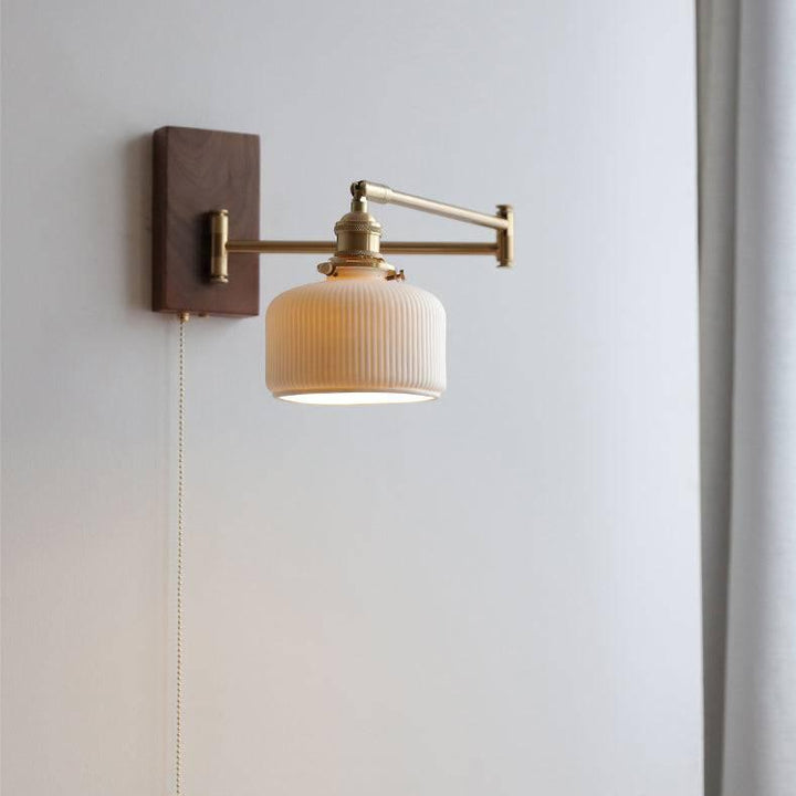 "Elegant ceramic wall lamp with wooden plate, featuring a modern design in cylinder or globe lampshade for stylish interiors.