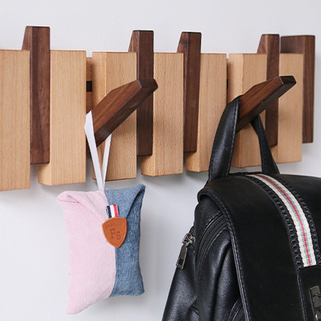 "Elegant handmade wooden piano coatrack front view, showcasing unique piano key design and quality craftsmanship in home deco
