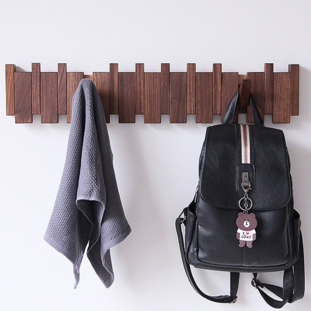 "Elegant handmade wooden piano coatrack front view, showcasing unique piano key design and quality craftsmanship in home deco