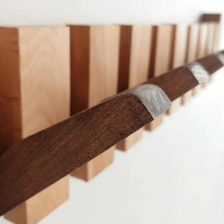 "Elegant handmade wooden piano coatrack front view, showcasing unique piano key design and quality craftsmanship in home deco