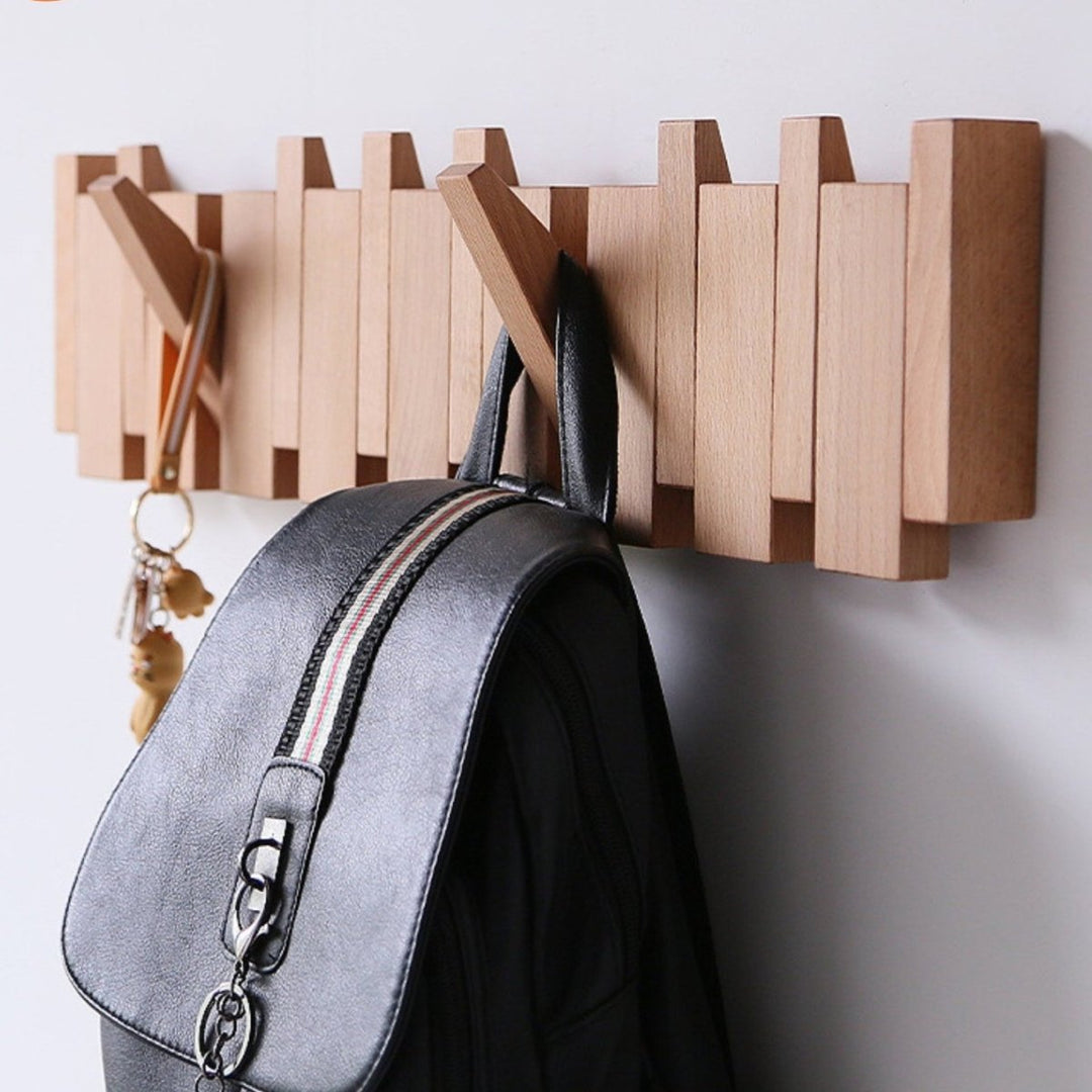 "Elegant handmade wooden piano coatrack front view, showcasing unique piano key design and quality craftsmanship in home deco