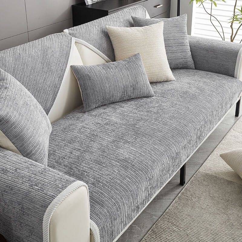 Elegant waterproof chenille sofa cover in soft hues, offering antimicrobial protection and sleek design for home decor.