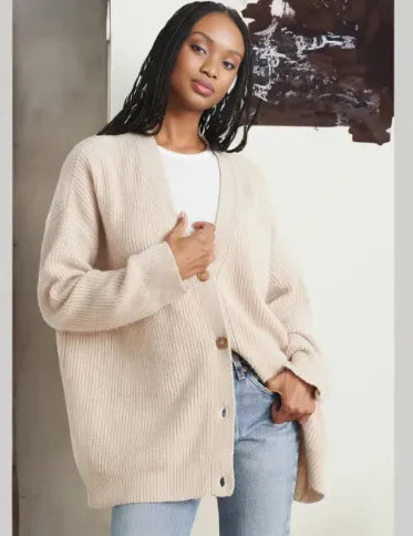 Elegant women's cashmere V-neck cardigan; soft, lightweight fabric in chic colors; perfect for layering and adding style.