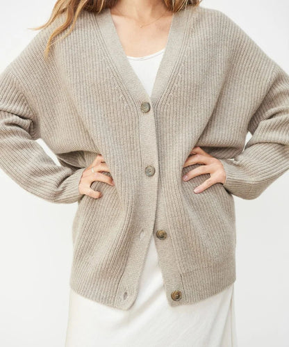 Elegant women's cashmere V-neck cardigan; soft, lightweight fabric in chic colors; perfect for layering and adding style.