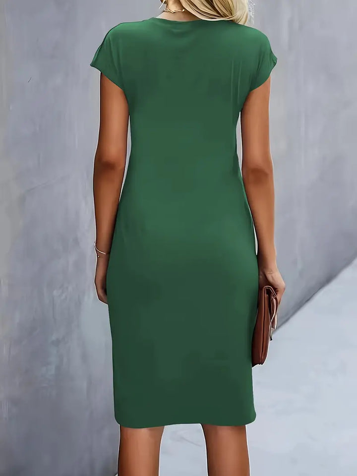 Elegant women's knee-length sheath dress with ruched waist, shown in dark green. Perfect for day-to-night wear.