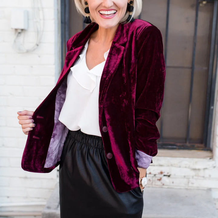 Elegant women's long-sleeved velvet blazer in soft velvet, tailored fit for formal or casual chic outfits.