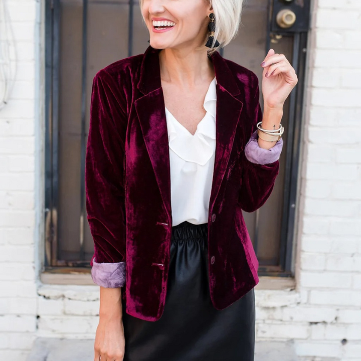 Elegant women's long-sleeved velvet blazer in soft velvet, tailored fit for formal or casual chic outfits.