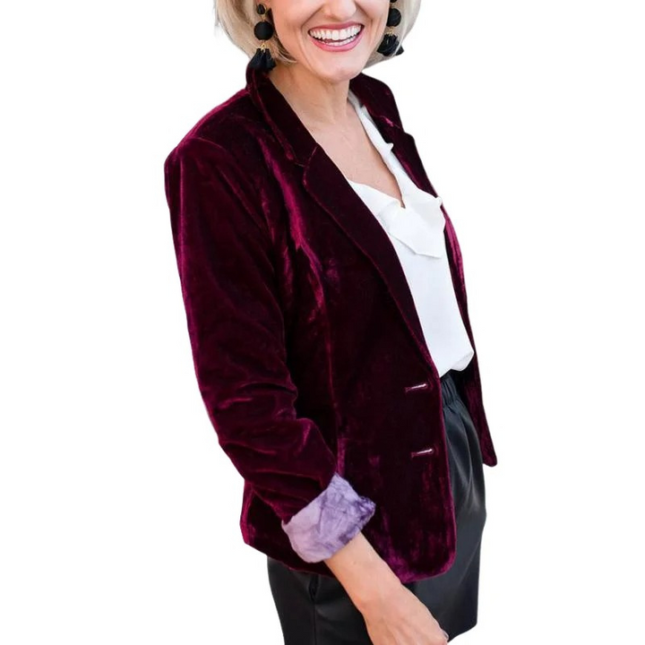 Elegant women's long-sleeved velvet blazer in soft velvet, tailored fit for formal or casual chic outfits.