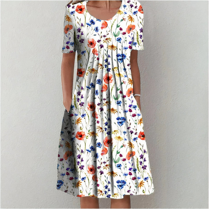 Elegant women's midi dress for spring and summer, featuring a mid-length hem and playful swing, ideal for warm days.