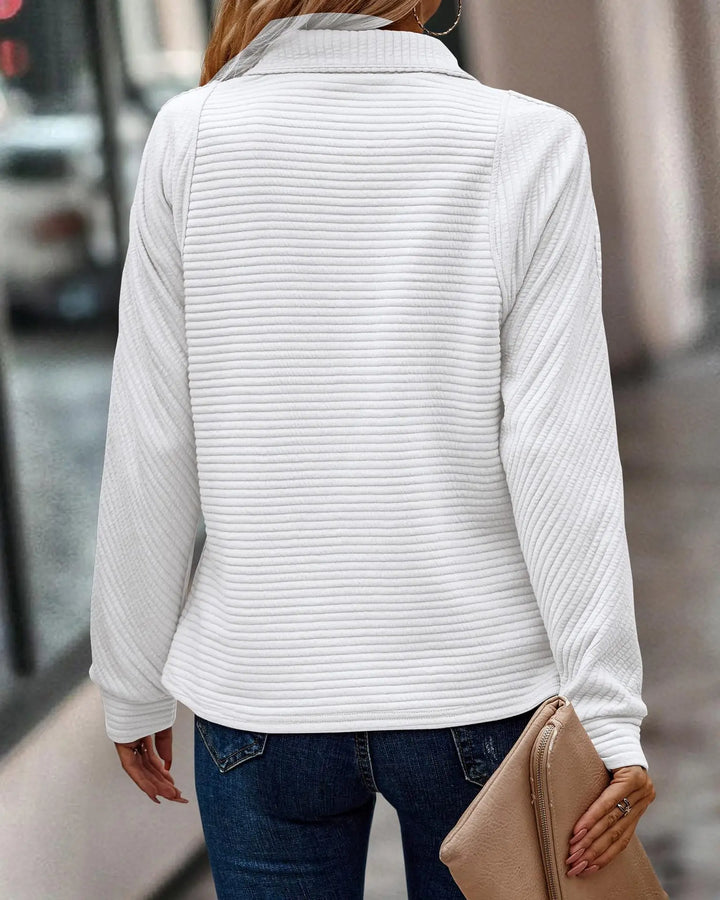 "Elegant women's V-neck jumper with chic half zip, in soft fabric for style and comfort, perfect for any occasion."
