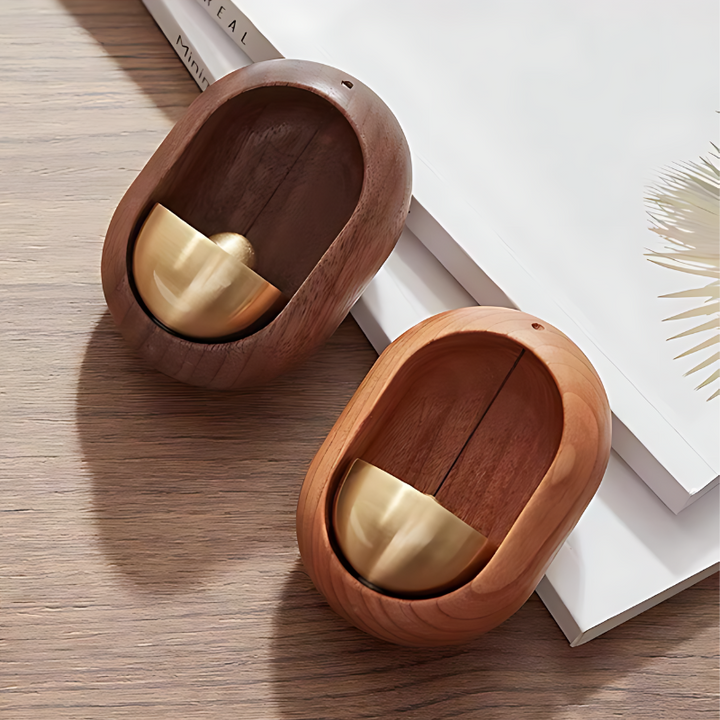 Elegant wooden door chimes with walnut and copper finish, available in Oval and Bird styles for home peace and tranquility.