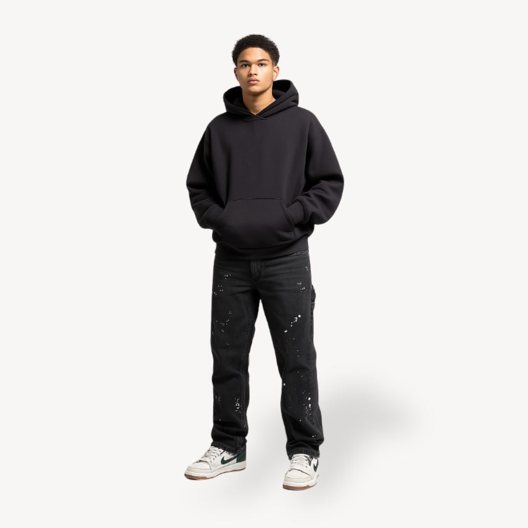 "Front view of men's slim fit stacked jeans in black, gray, blue, showing modern streetwear style and extended leg length."