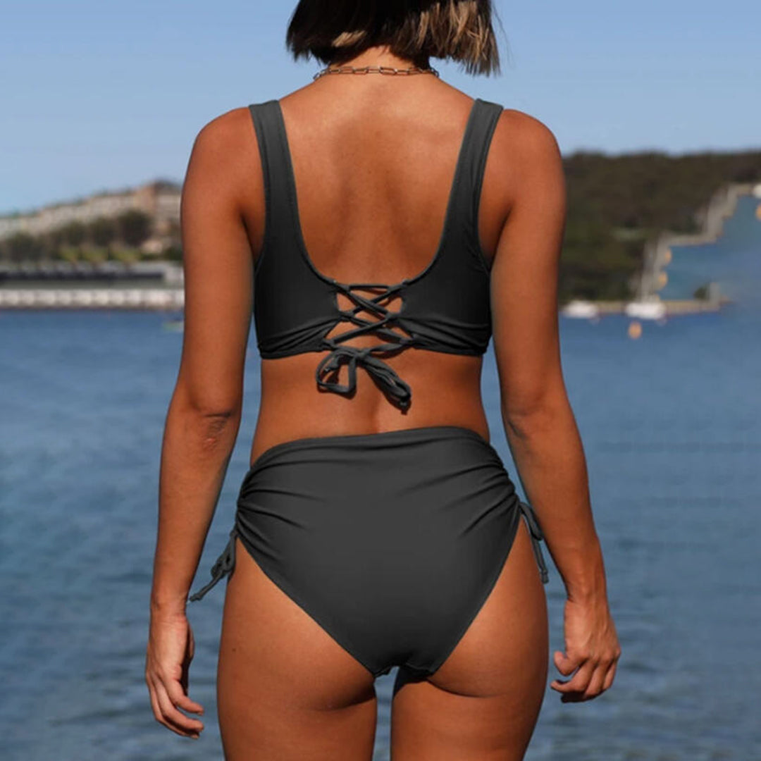 "Green high-waisted bikini set for women, flattering fit, supportive top, stylish swimwear, tummy control, quick-drying."