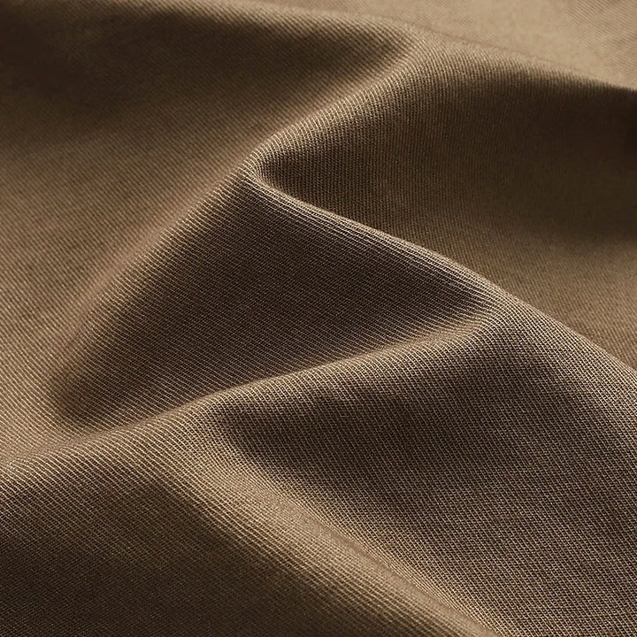 Knee-length men's durable cargo shorts with a rugged look and multiple pockets, ideal for outdoor and casual wear.