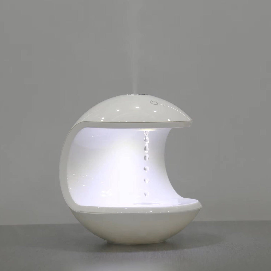 "Levitating Water Droplet Ultrasonic Humidifier with LED light, showing floating droplets effect, perfect for modern decor."