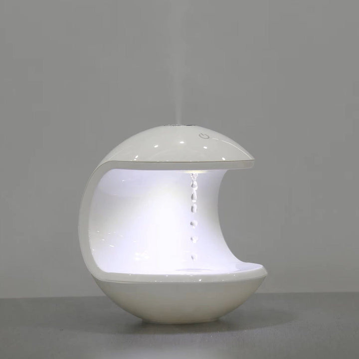 "Levitating Water Droplet Ultrasonic Humidifier with LED light, showing floating droplets effect, perfect for modern decor."