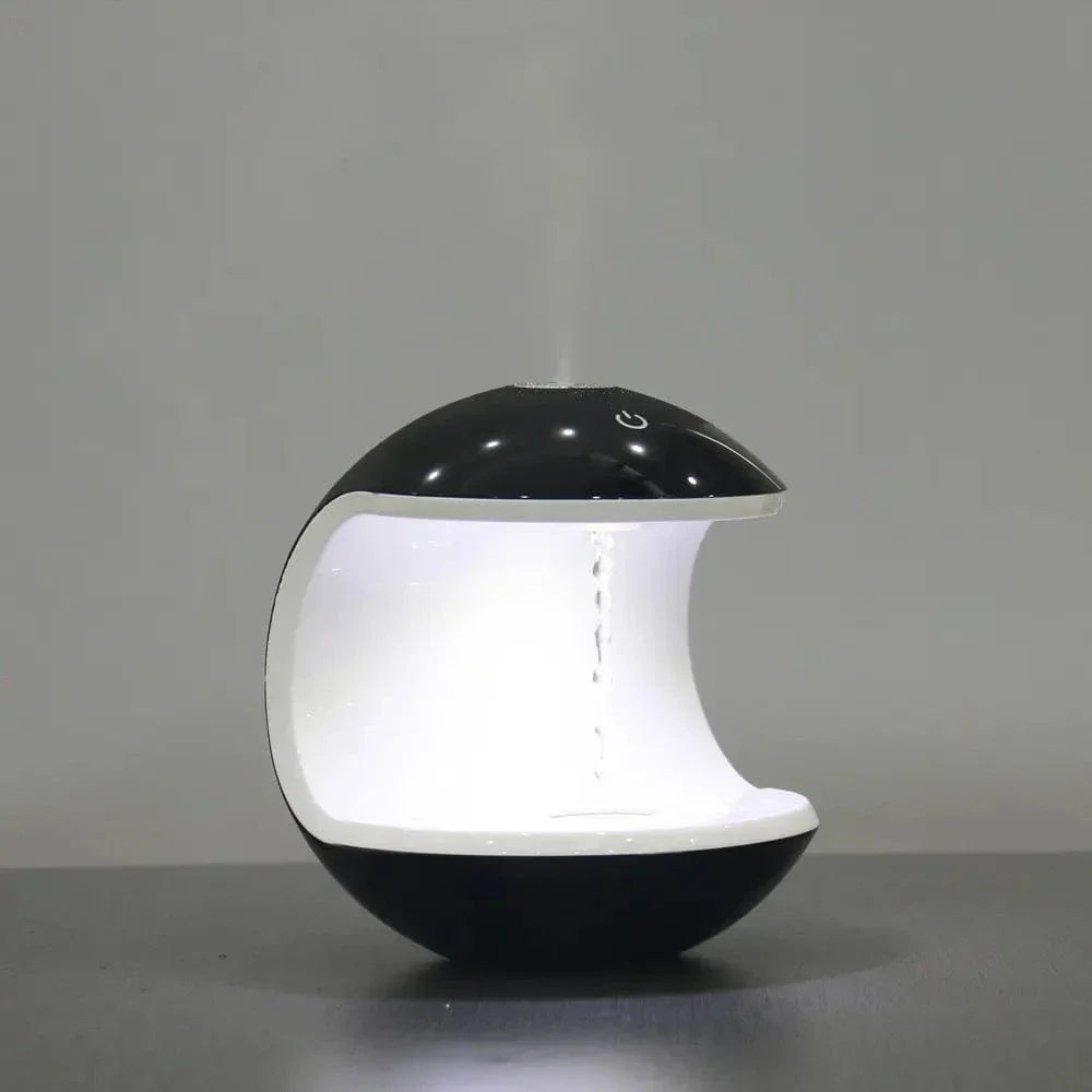 "Levitating Water Droplet Ultrasonic Humidifier with LED light, showing floating droplets effect, perfect for modern decor."