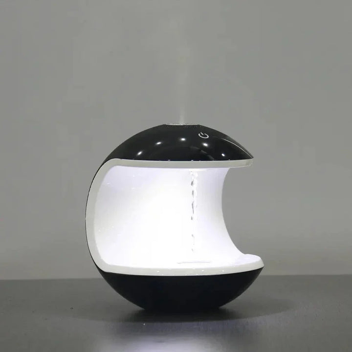 "Levitating Water Droplet Ultrasonic Humidifier with LED light, showing floating droplets effect, perfect for modern decor."