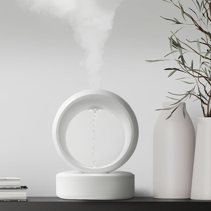 "Levitating Water Droplet Ultrasonic Humidifier with LED light, showing floating droplets effect, perfect for modern decor."