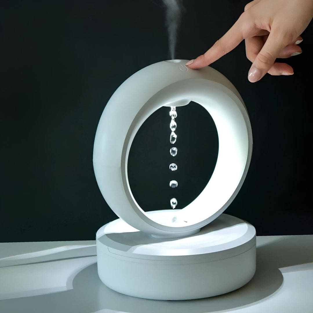"Levitating Water Droplet Ultrasonic Humidifier with LED light, showing floating droplets effect, perfect for modern decor."