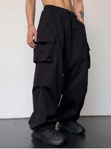 "Men's baggy wide leg cargo pants with large pockets, relaxed fit, durable fabric, perfect for casual style and comfort."