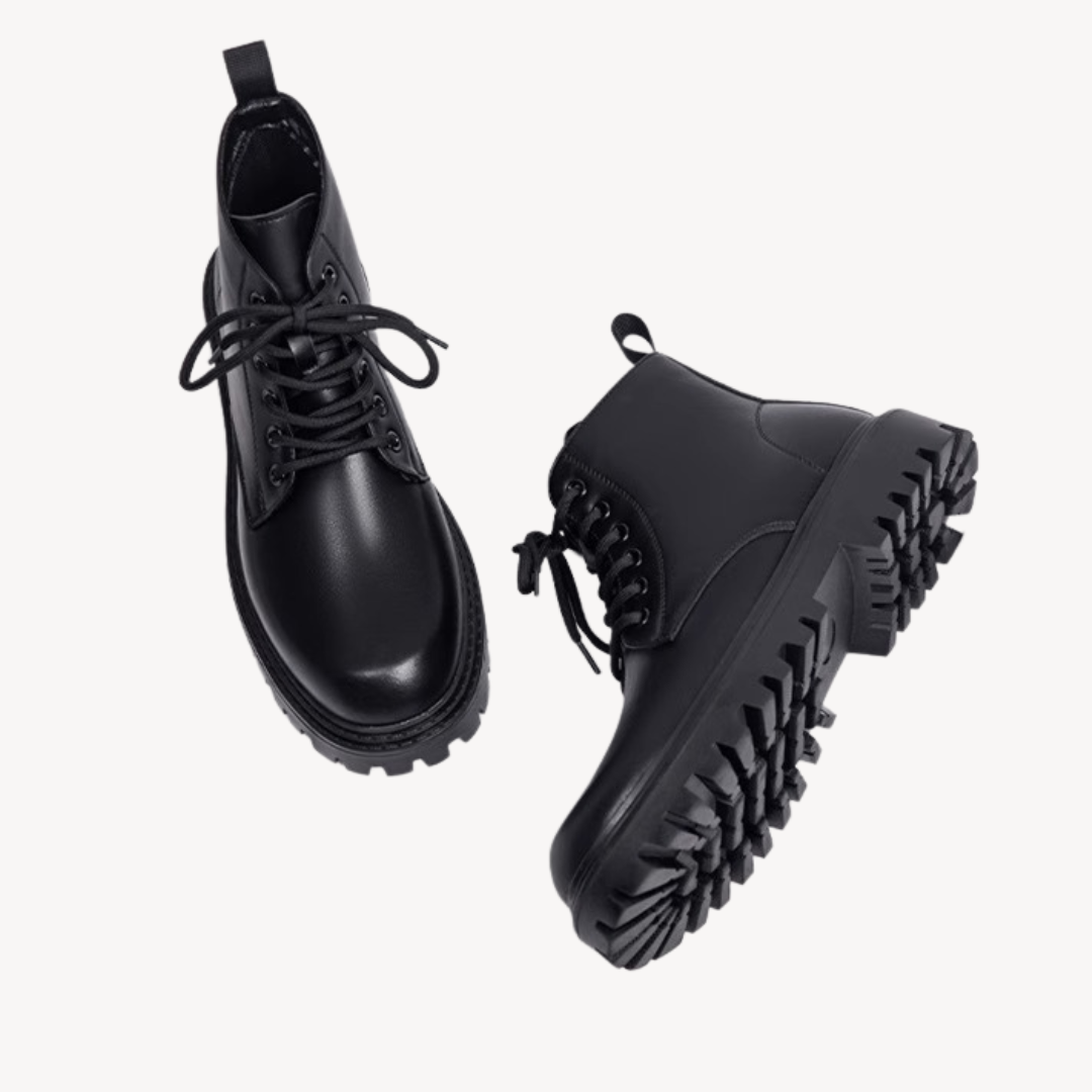 "Men's black leather combat boots with chunky sole, front view, showcasing rugged durability and modern style in premium mate