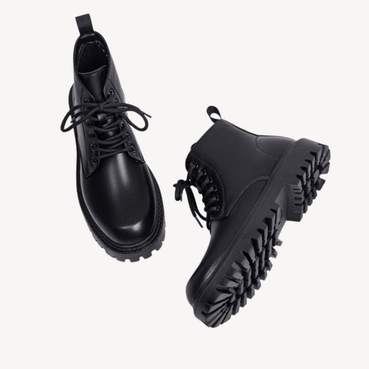 "Men's black leather combat boots with chunky sole, front view, showcasing rugged durability and modern style in premium mate