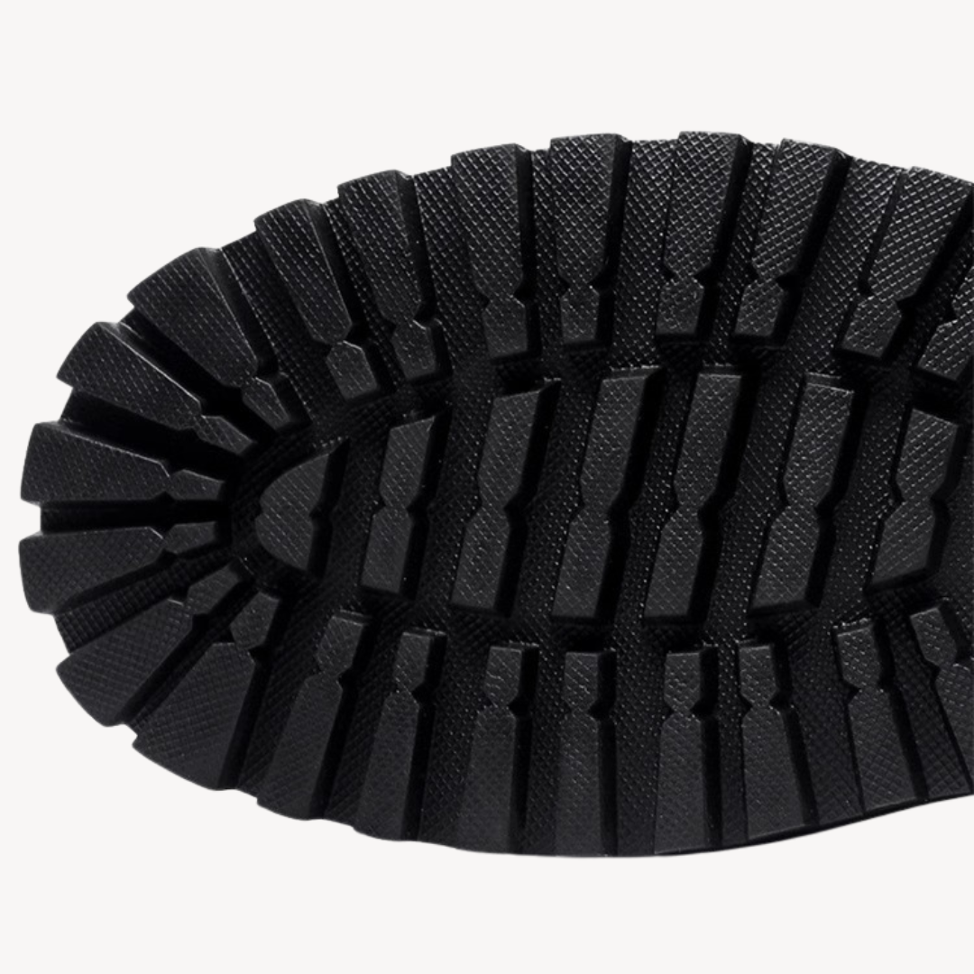 "Men's black leather combat boots with chunky sole, front view, showcasing rugged durability and modern style in premium mate