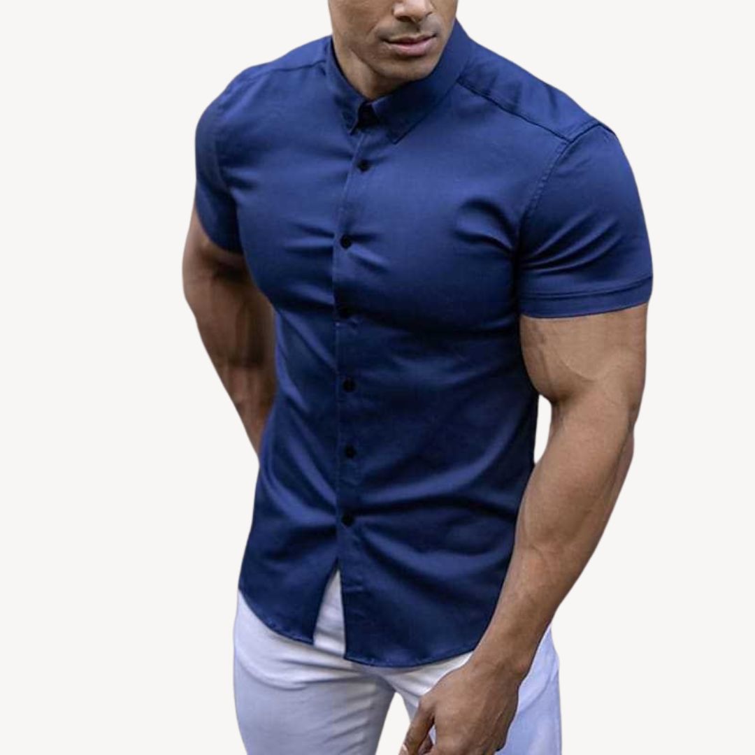 "Men's black muscle fit shirt, cotton spandex, short sleeve, highlighting athletic build, ideal for versatile styling."