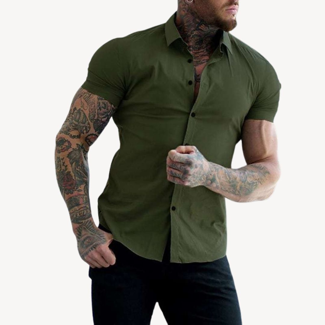 "Men's black muscle fit shirt, cotton spandex, short sleeve, highlighting athletic build, ideal for versatile styling."