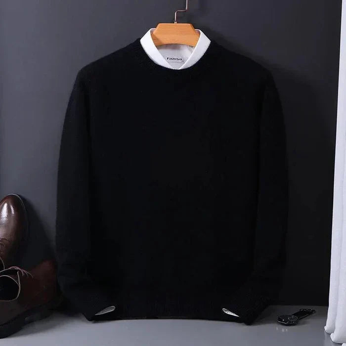 "Men's cashmere loose sweater, soft grey hue, relaxed fit, ribbed finishes, perfect for versatile autumn-winter style."