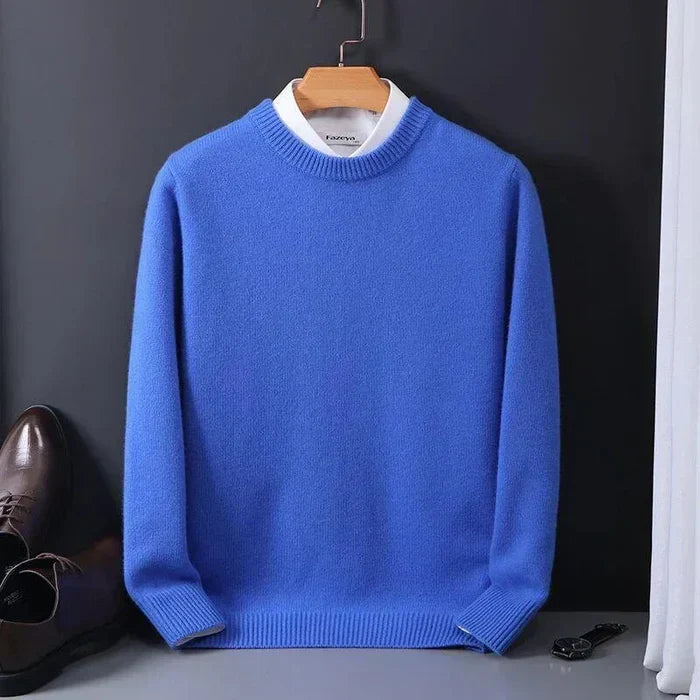 "Men's cashmere loose sweater, soft grey hue, relaxed fit, ribbed finishes, perfect for versatile autumn-winter style."