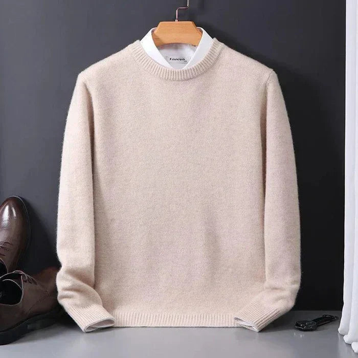 "Men's cashmere loose sweater, soft grey hue, relaxed fit, ribbed finishes, perfect for versatile autumn-winter style."