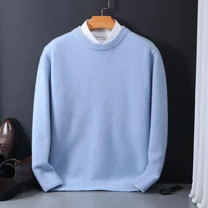 "Men's cashmere loose sweater, soft grey hue, relaxed fit, ribbed finishes, perfect for versatile autumn-winter style."