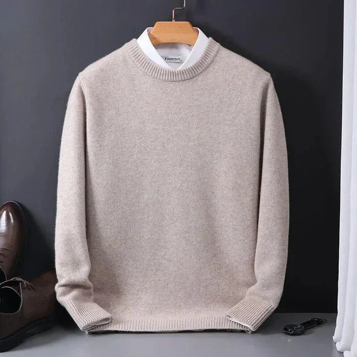 "Men's cashmere loose sweater, soft grey hue, relaxed fit, ribbed finishes, perfect for versatile autumn-winter style."
