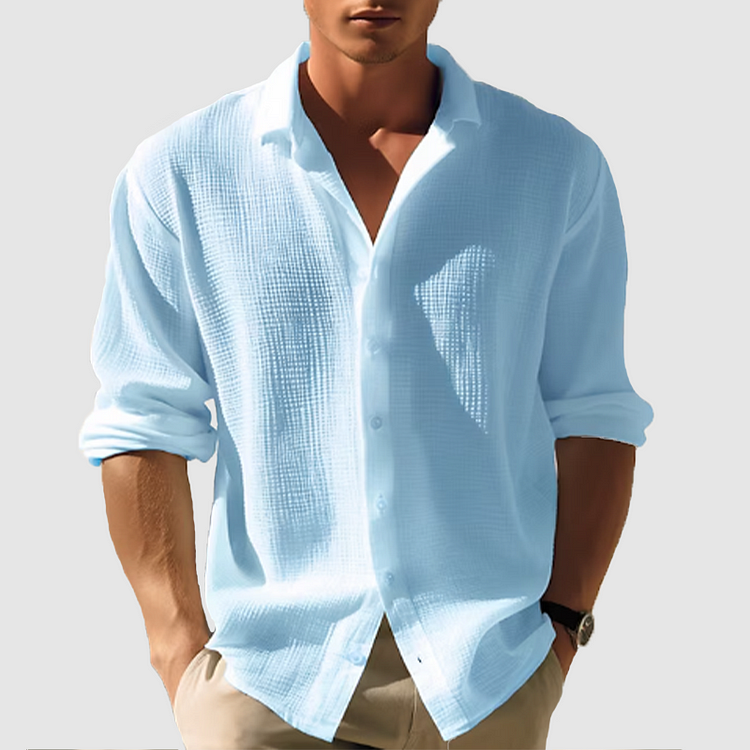 Men's casual button-down shirt, sleek design, versatile for casual or semi-formal wear, shown in light blue fabric.